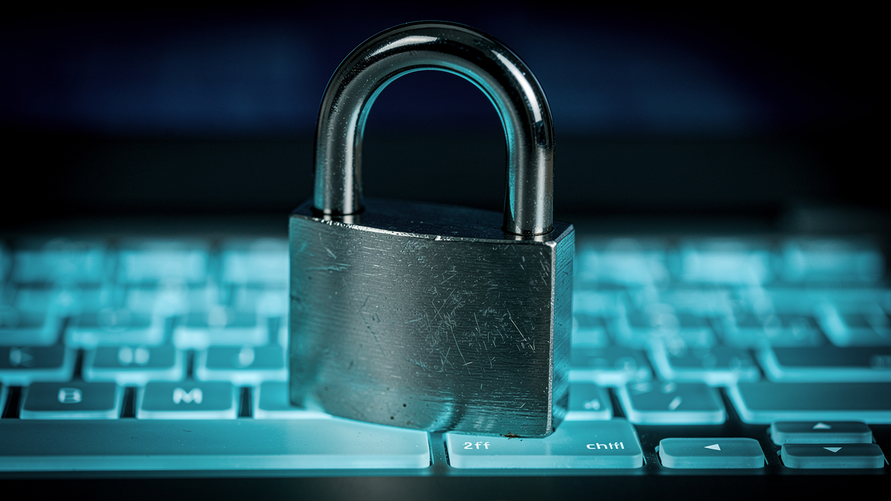 Metal padlock on laptop symbolizing secure document conversion